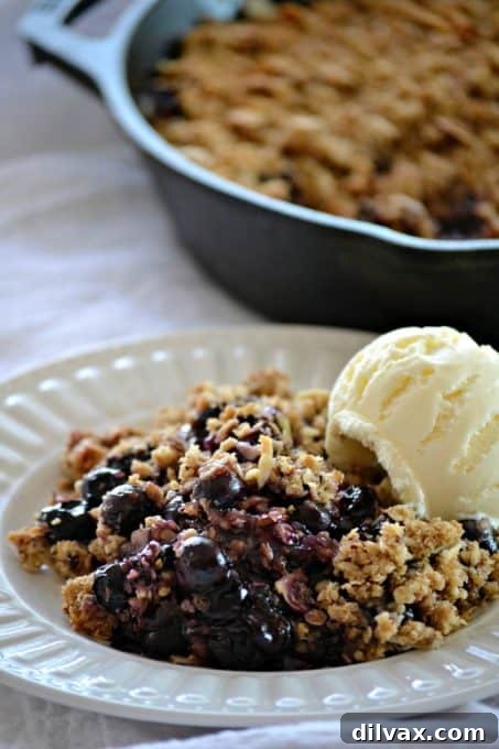 Golden Skillet Blueberry Crisp 14 This Skillet Blueberry Crisp with fresh blueberries, an almond oatmeal topping and topped with a scoop of vanilla ice cream, make it the perfect dessert!