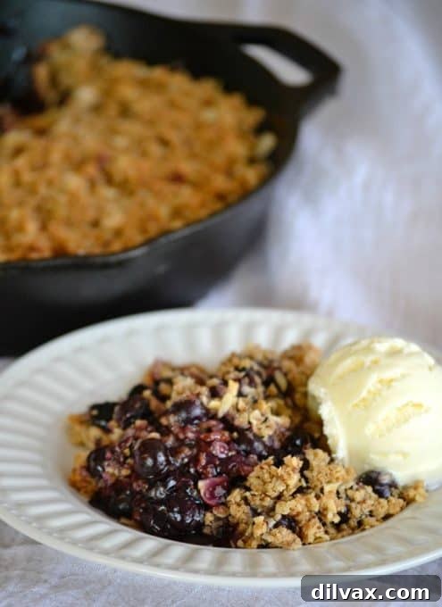 Golden Skillet Blueberry Crisp 15 This Skillet Blueberry Crisp with fresh blueberries, an almond oatmeal topping and topped with a scoop of vanilla ice cream, make it the perfect dessert!