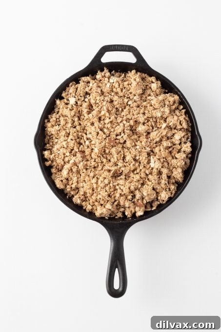 Golden Skillet Blueberry Crisp 7 A skillet crisp with blueberries ready for the oven.