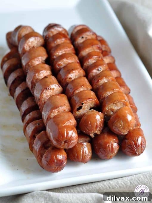 Spiral grilled hot dogs, charred and perfect for toppings.