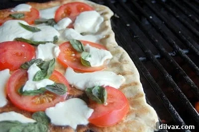 Grilled Margherita Pizza with fresh basil and mozzarella.