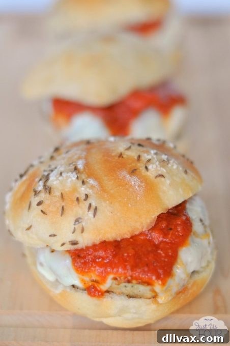 A hearty Chicken Parmesan Burger with melted cheese and marinara sauce.