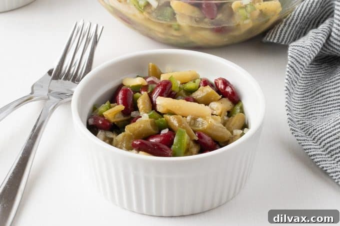 Three Bean Salad served in a bowl, showcasing its vibrant colors and fresh ingredients.