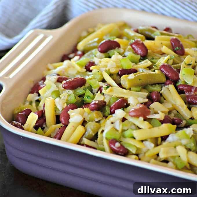 This Easy Three Bean Salad with green beans, wax beans and kidney beans marinated in a simple vinegar dressing is a great side dish with dinner for those hot summer nights.