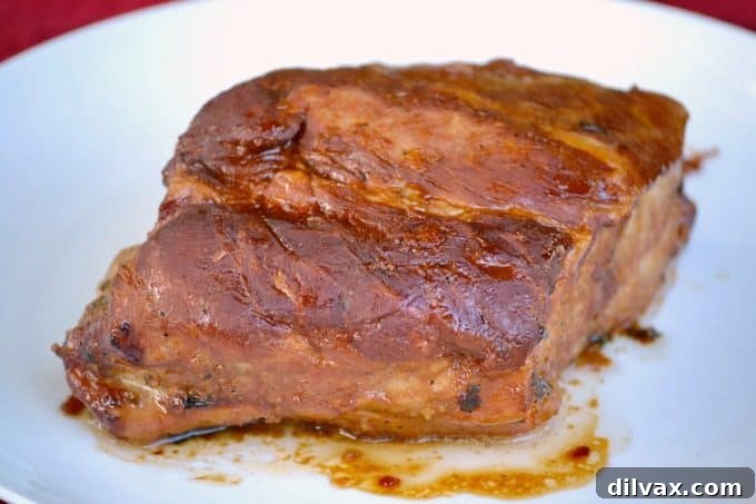This Slow Cooker Spicy Orange Pork Roast is incredibly easy to make, offering a burst of great flavor perfect for slicing or shredding into lettuce wraps.