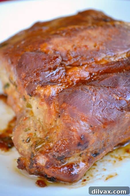This Slow Cooker Spicy Orange Pork Roast is incredibly easy to make, offering a burst of great flavor perfect for slicing or shredding into lettuce wraps.