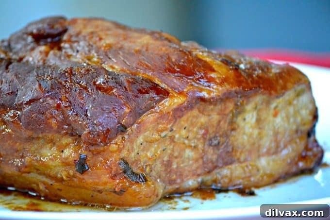 This Slow Cooker Spicy Orange Pork Roast is incredibly easy to make, offering a burst of great flavor perfect for slicing or shredding into lettuce wraps.