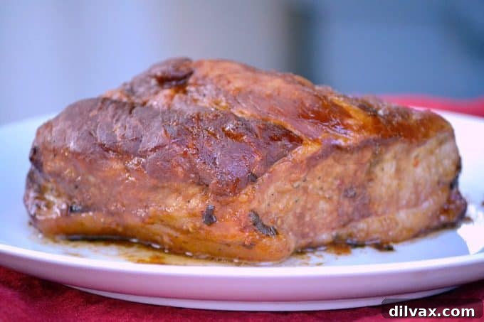 This Slow Cooker Spicy Orange Pork Roast is incredibly easy to make, offering a burst of great flavor perfect for slicing or shredding into lettuce wraps.