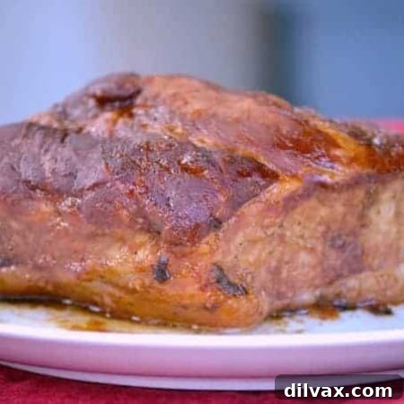 A delicious Slow Cooker Spicy Orange Pork Roast, perfect for slicing or shredding into lettuce wraps.