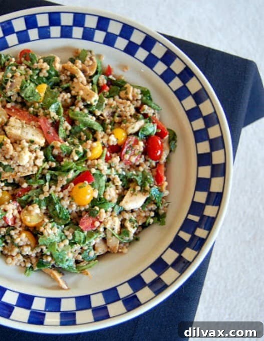 A light and refreshing Israeli Couscous Chicken Salad, packed with vibrant vegetables, tender chicken, and chewy pearl couscous, dressed in a lemon-herb vinaigrette.