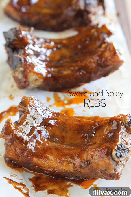 Making Sundays Simple: Week 62 Meal Plan 6 Juicy Sweet and Spicy Ribs piled on a platter, glistening with sauce and ready to be served.