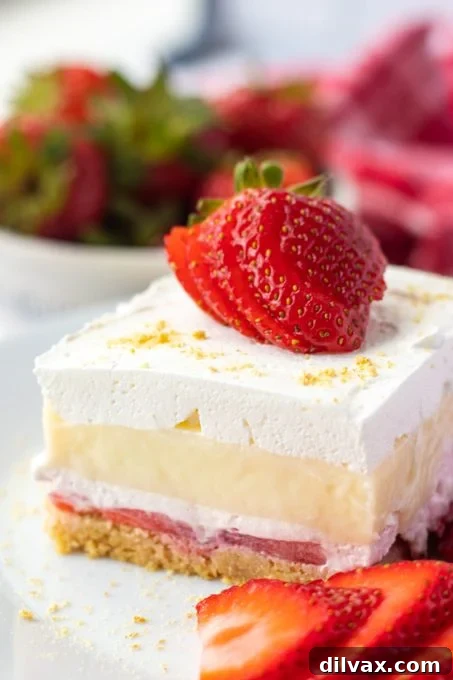 No Bake Strawberry Cheesecake Dream Bars, a perfect summer dessert with a creamy filling and fresh strawberry topping.