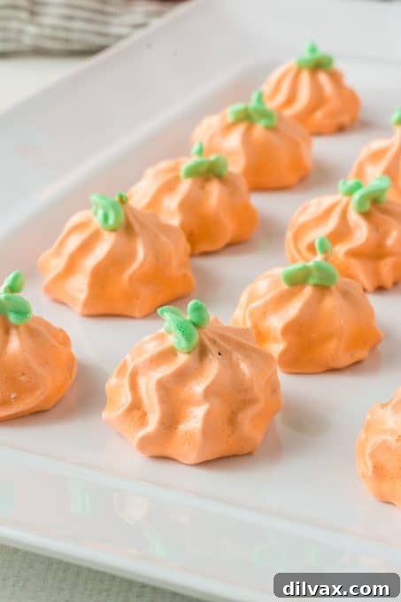 Stacked Pumpkin Spice Meringue Pumpkins, showcasing their delightful texture and color