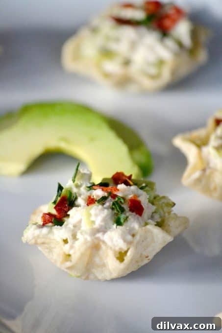 Avocado Tuna Delights 3 These Avocado Tuna Salad Bites are a delightful party appetizer, seasoned with chives and chili pepper flakes for an extra kick.
