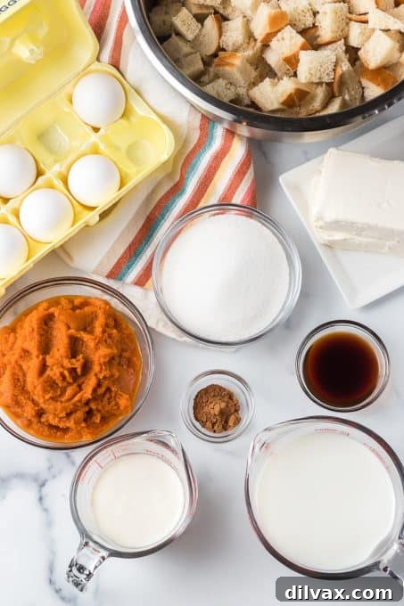Spiced Pumpkin French Toast Bake 4 Ingredients for make-ahead Pumpkin Baked French Toast casserole laid out on a table