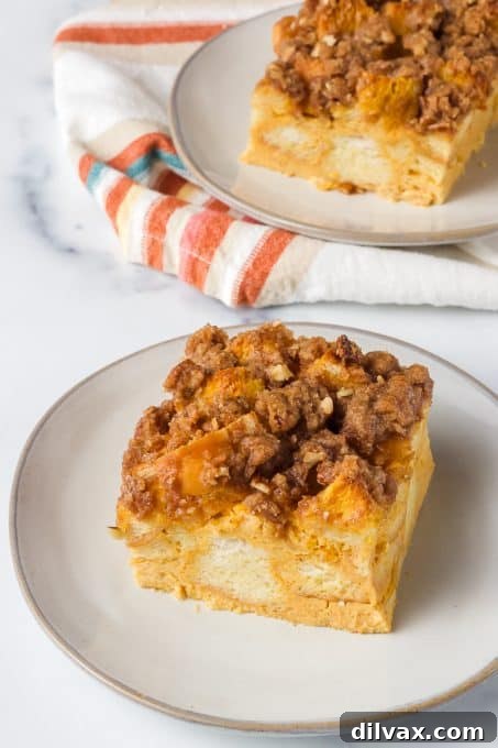 Spiced Pumpkin French Toast Bake 7 A perfectly baked slice of Pumpkin Spice Baked French Toast on a plate