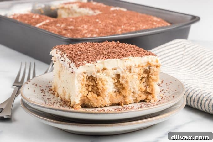 Tiramisu Poke Cake - a simple, moist cake with coffee syrup and mascarpone frosting