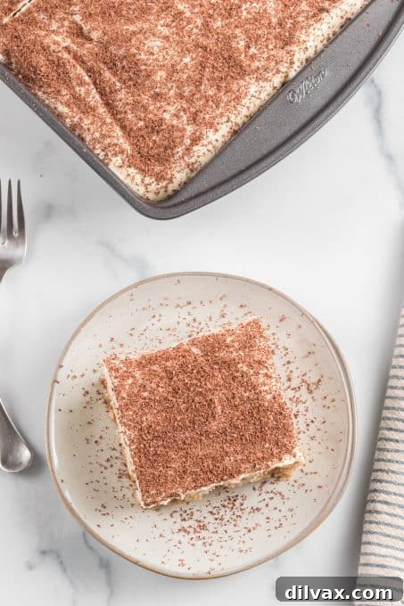 Top view of a white cake with coffee syrup and mascarpone frosting