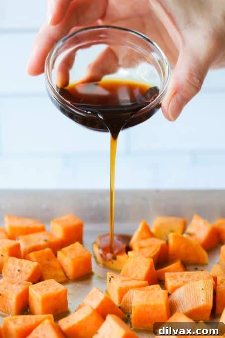 Drizzling maple syrup on sweet potatoes