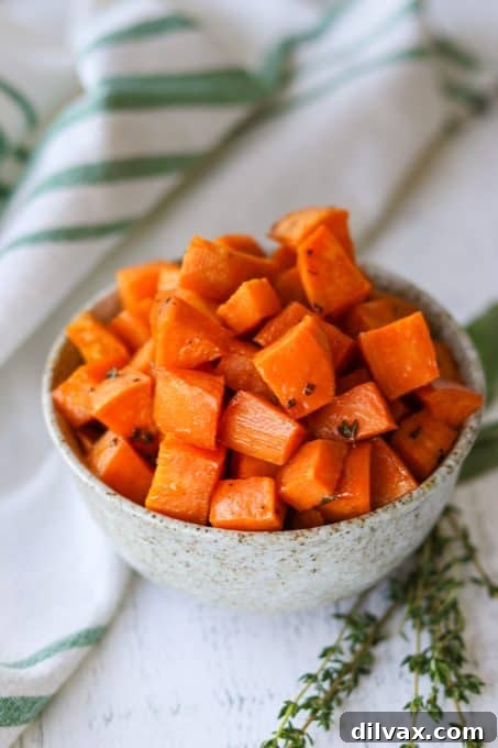 Roasted sweet potatoes with maple syrup and fresh herbs.