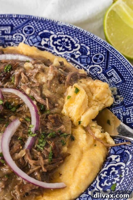 A bite of polenta and salsa verde short ribs.