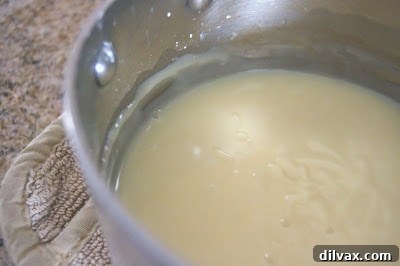 Campfire Delight Cake 6 Vanilla Cream Filling cooling in a saucepan