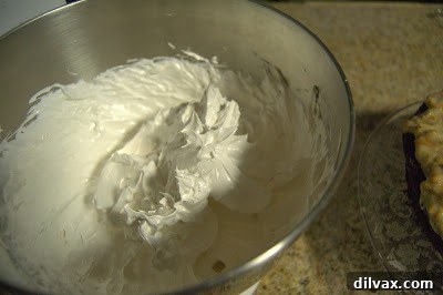 Campfire Delight Cake 7 Fluffy, white Marshmallow Frosting in a mixing bowl
