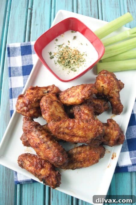 Touchdown Treats 5 Flavorful Caribbean jerk wings, offering a unique and zesty option for your football party spread.
