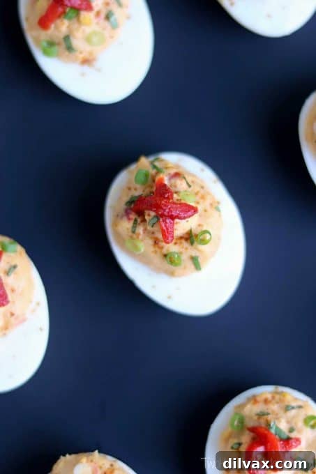 Touchdown Treats 28 Elegant Mediterranean deviled eggs with roasted red pepper hummus, a fresh and flavorful appetizer.