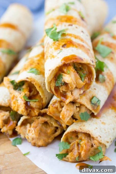 Touchdown Treats 35 Easy honey BBQ slow cooker chicken taquitos, a delicious and simple party food.