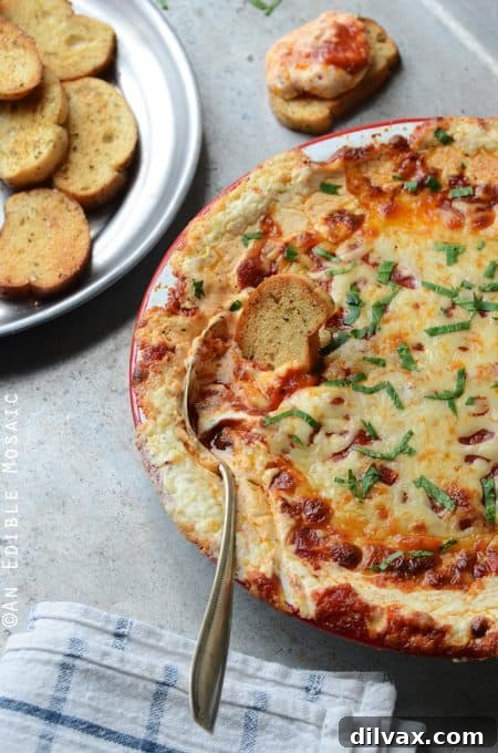 Touchdown Treats 12 Warm and gooey baked pizza dip, an irresistible appetizer reminiscent of your favorite pizza.