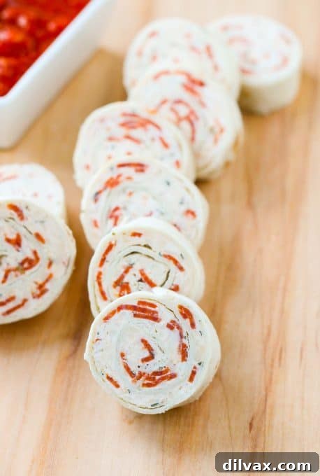 Touchdown Treats 45 Fun and flavorful pepperoni pizza tortilla pinwheels, a kid-friendly game day snack.