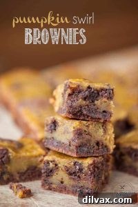 Rich Pumpkin Swirl Brownies with a distinct pumpkin marbling, cut into perfect squares.