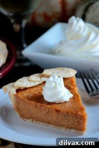 A beautifully baked Sweet Potato Pie with a golden crust, ready to be sliced and served.