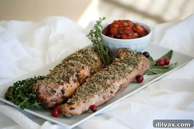 This Dijon Herb Roasted Pork with Cranberry Pear Chutney made with a Smithfield Prime Pork Tenderloin is an easy and delicious dinner perfectly suited for holiday entertaining!