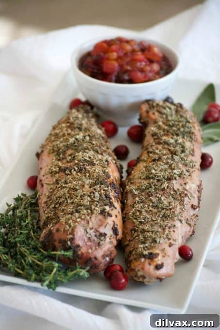 This Dijon Herb Roasted Pork with Cranberry Pear Chutney made with a Smithfield Prime Pork Tenderloin is an easy and delicious dinner perfectly suited for holiday entertaining!