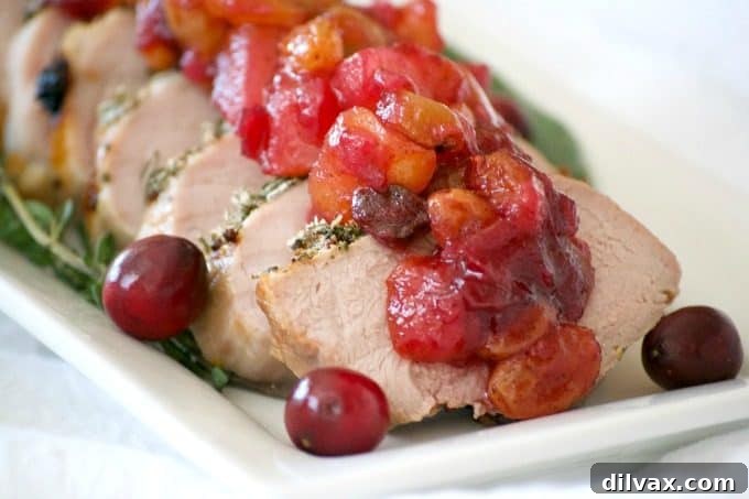 This Dijon Herb Roasted Pork with Cranberry Pear Chutney made with a Smithfield Prime Pork Tenderloin is an easy and delicious dinner perfectly suited for holiday entertaining!