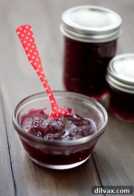 Jellied cranberry sauce with Grand Marnier, glistening in a bowl.