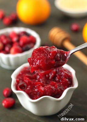 Honey sweetened orange cranberry sauce in a decorative bowl.