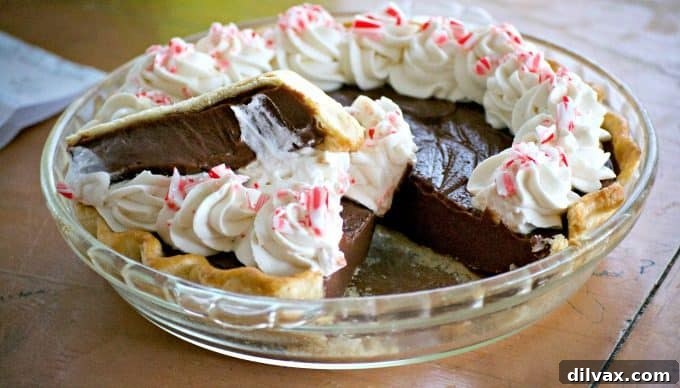 Silken Chocolate Peppermint Cloud Pie 7 Chocolate Peppermint Cream Pie being prepared in a kitchen, showing the delicious filling.