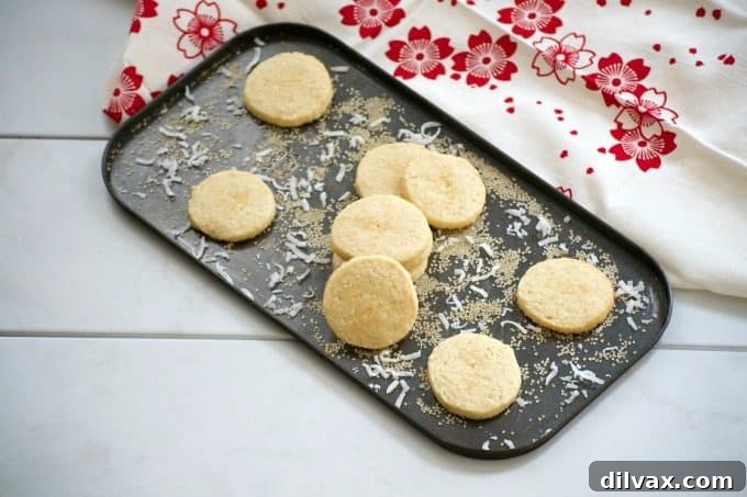 This Coconut Macadamia Nut Shortbread is a butter shortbread cookie with shredded coconut and macadamia nuts to remind you of the tropics.