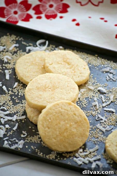 This Coconut Macadamia Nut Shortbread is a butter shortbread cookie with shredded coconut and macadamia nuts to remind you of the tropics.