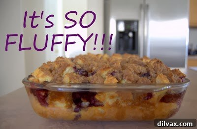 A casserole dish filled with golden brown blueberry French toast bake.