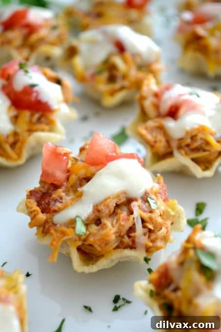 Pinterest-Perfect Game Day Boards 12 The perfect Game Day appetizer - Chicken Enchilada Bites with a Green Chile Enchilada Cream Sauce! These savory, cheesy bites are easy to make and perfect for a crowd.
