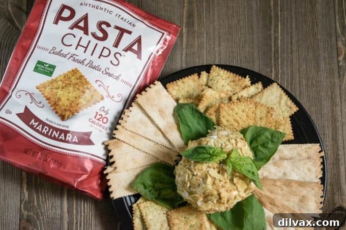 Pinterest-Perfect Game Day Boards 5 An appetizing Easy Italian Style Cheese Ball, a delightful and shareable appetizer from Geeks Who Eat, ideal for Super Bowl parties.