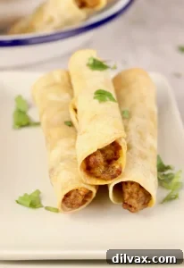 Pinterest-Perfect Game Day Boards 10 Crispy and savory Cheesy Ground Beef Taquitos from Miss in the Kitchen, a perfect handheld snack for any Super Bowl party.