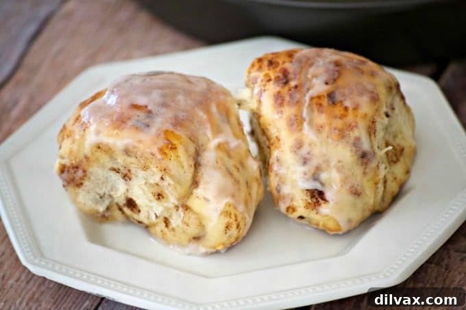 Fluffy golden brown cinnamon rolls filled with rich Nutella, fresh out of the oven, ready for icing