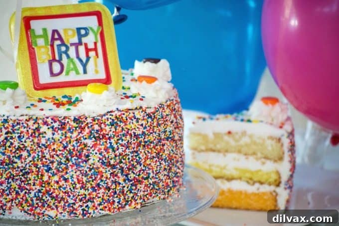 A colorful Citrus Layer Cake with ombre vanilla, lemon, and orange layers, decorated with balloons for a joyful birthday. Vibrant ombre Citrus Layer Cake with vanilla, lemon, and orange layers, beautifully decorated and enhanced by helium-filled balloons from Balloon Time, perfect for a festive birthday celebration.