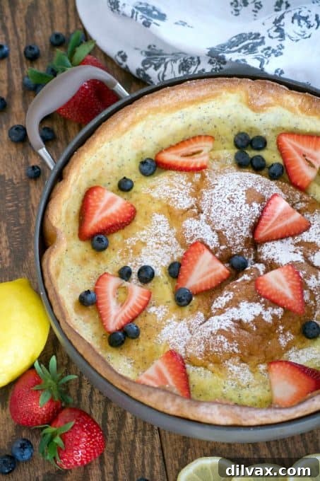 Another view of the light and fluffy Lemon Poppy Seed Dutch Baby, a perfect oven-baked German pancake for a weekend breakfast.