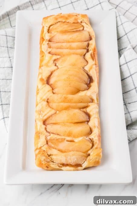 Pears on top of a sweet cream filling in puff pastry.